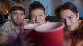 Diverse international friends celebrate birthday toasting on video chat call. students Christmas celebration online during coronavirus lockdown, mens party with beer and football. - Powered by Shutterstock - Get 15% off with code: PIKWIZARD15