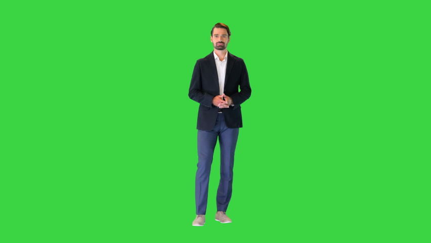 Young businessman in suit talking to camera on a Green Screen, Chroma Key. | Shutterstock HD Video #1067396912