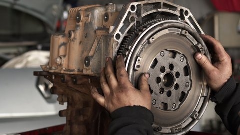 Auto Car Mechanic Installed Flywheel at Repair Shop on Car Engine Footage.