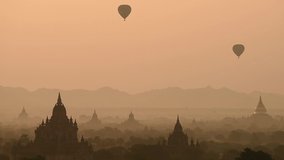 Time lapse of hot air balloon with sunrise at Old Bagan, Myanmar. Asia travel, Asian top destination, Myanmar travel, Culture, Adventure, pagoda, landscape, sunrise scene or travel video Concept