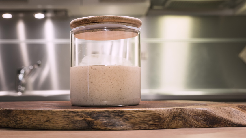 Homemade Sourdough Starter Rising In A Jar During Fermentation - time lapse, zoom-in | Shutterstock HD Video #1067410016
