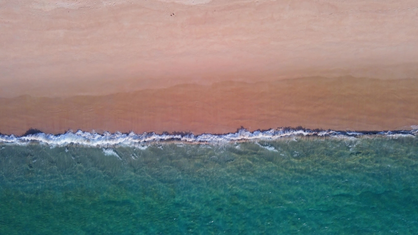 (Top view) Aerial view drone over beach sea. Beautiful sea waves. Beach sand and amazing sea. Summer sunset seascape. Phuket Thailand Beach. Water texture. Top view of the fantastic natural sunsets | Shutterstock HD Video #1067413544