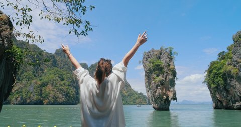 Asian traveler with relaxing on amazing nature sea beach joy view James Bond island, Phuket, travel Thailand, Beautiful destination landscape Asia, Summer holiday outdoor vacation trip.