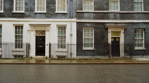 LONDON, circa 2021 - Wide tracking shot of 10 and 11 Downing Street, the official residences of the UK Prime Minster and Chancellor of the Exchequer, respectively
