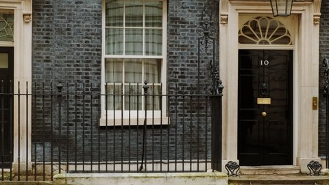 LONDON, circa 2021 - Tracking shot of 10 and 11 Downing Street, the official residences of the UK Prime Minster and Chancellor of the Exchequer, respectively