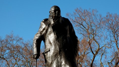LONDON, circa 2021 - Close-up of the Statue of Winston Churchill sculpted in bronze, located in Parliament Square, Westminster, London, England, UK