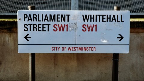 LONDON, circa 2021 - Close-up view of Parliament Street and Whitehall street signs in Whitehall, Westminster, London, England, UK