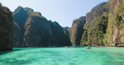 View of Maya Bay, the beach with long-tail boats and tourists, Phi Phi Lay Island, Krabi Province, Thailand, Southeast Asia, Asia, Amazing thailand travel.