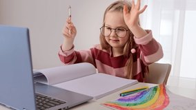 Distance remote education online learning lesson at home. Little child girl doing homework studying watching web class lesson or listening tutor teacher video call use laptop. - Powered by Shutterstock - Get 15% off with code: PIKWIZARD15
