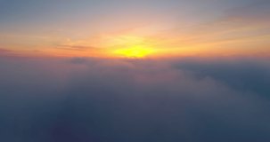 Flying high in the clouds, beautiful sunrise in the sky, aerial view 4k video