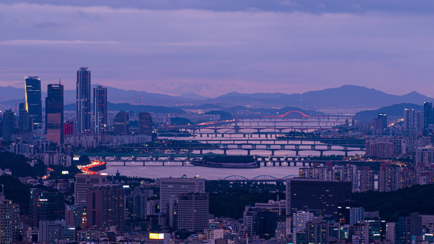 Day to night,Time lapse,Aerial view of Seoul city and Han river and sunset Sky,South Korea,Zoom out Royalty-Free Stock Footage #1067434793