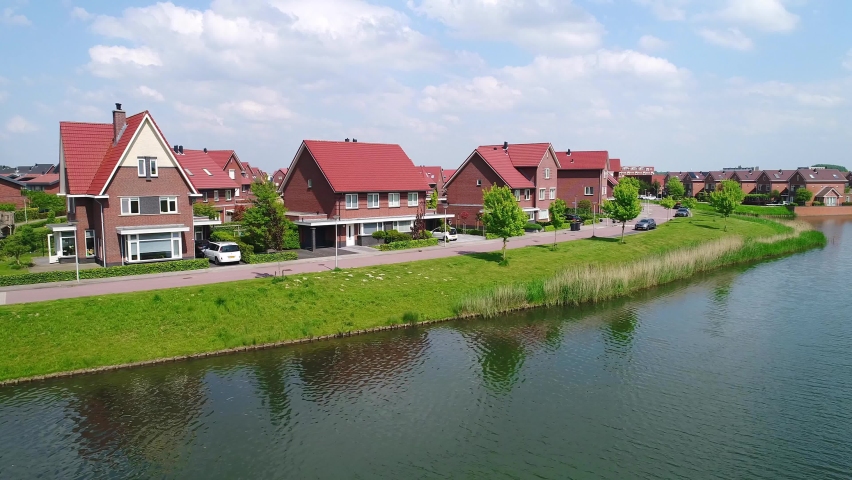 Beautiful view of the suburb of Rotterdam in South Holland, Netherlands, with beautiful houses and a clear river