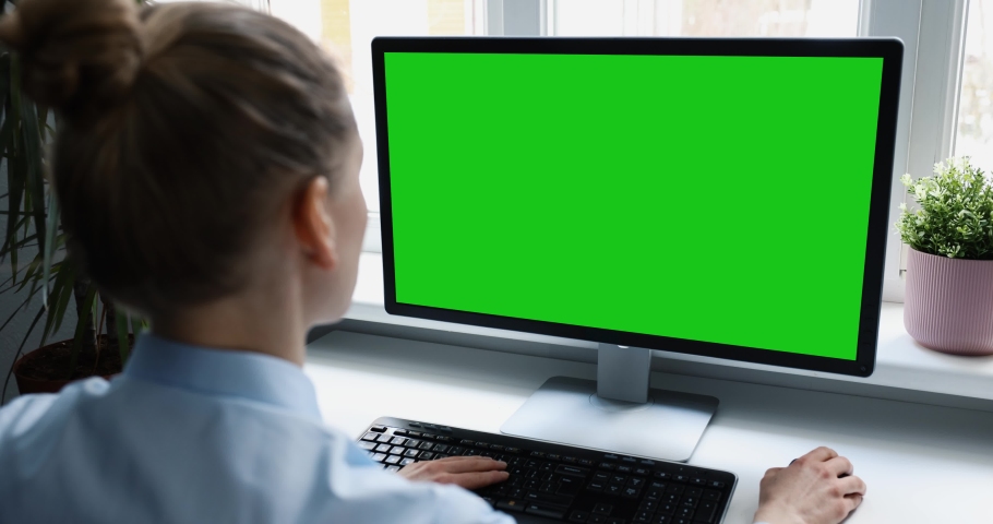 woman using desktop computer in office, scrolling mouse. mockup with blank green screen Royalty-Free Stock Footage #1067452559