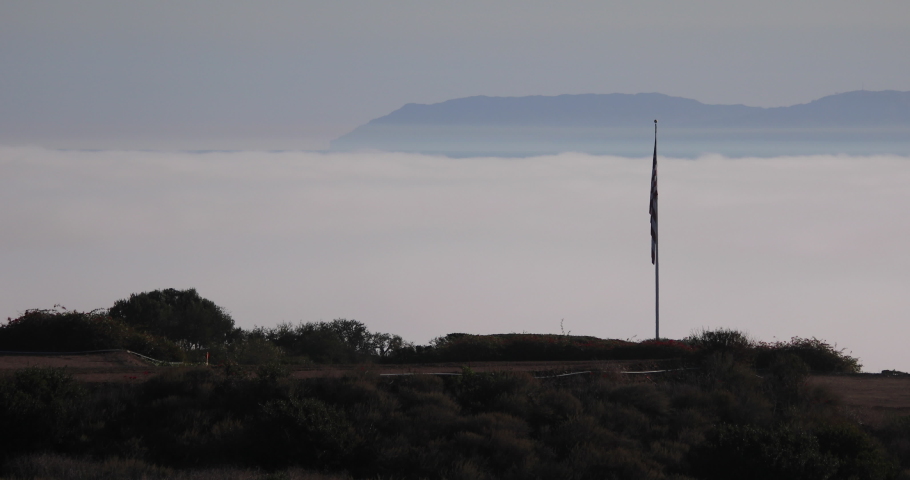 View of marine layer between Palos Verdes and Catalina Island on a sunny day in Los Angeles, California.
