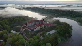 Foggy Dawn near the Nesvizh Castle. Nesvizh. An old castle . Belarus