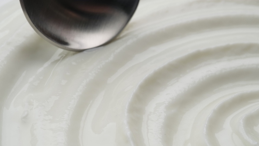 Sour cream with spoon, fresh greek yogurt close up Royalty-Free Stock Footage #1067458382