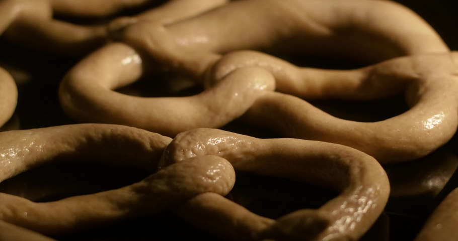 Delicious traditional German pretzels while baking go high in the oven in time lapse