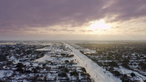 Aerial Tracking Shot of Snow Blanketing Suburbs of Dallas During Historic Winter Storm