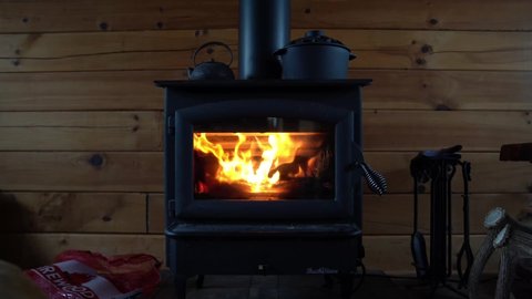 wood burning stove in a log cabin