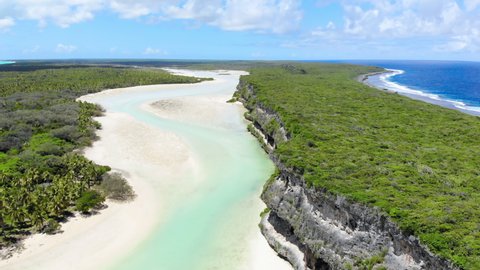 Aerial, Cliffs of Lekiny in the same lagoon as Mouli bridge. Exotic Ouvea Island. New Caledonia Tourism. High quality 4k footage. Territory of France.