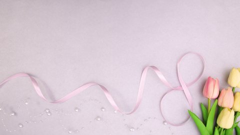  Romantic feminine decoration with flowers and ribbons. Stop motion 