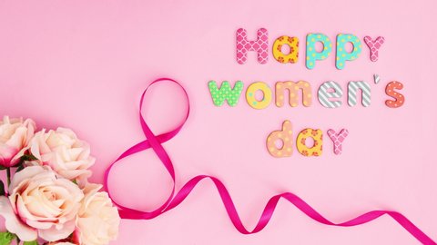Happy Women's day text appear with ribbons and flowers . Stop motionv