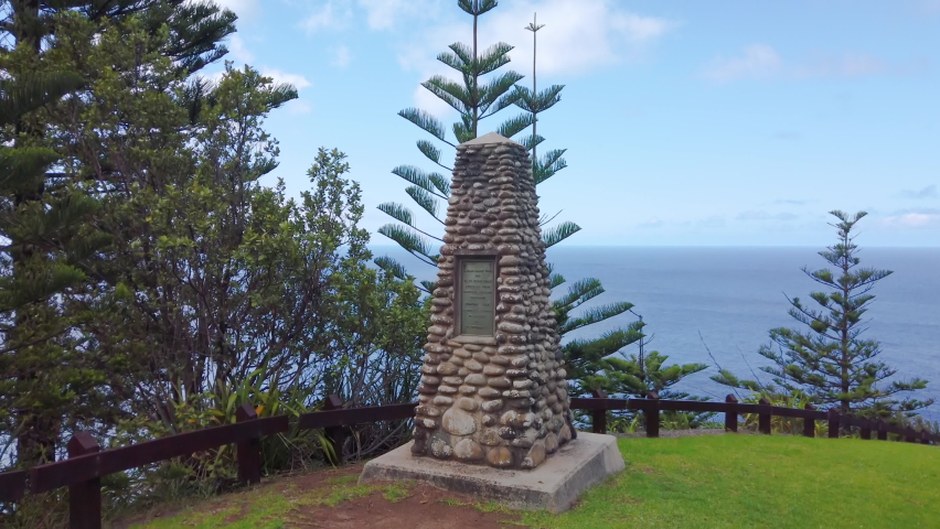 Left to right panning moption of the Captain cook monument on the northern coast of Norfolk Island where Captain James Cook and his officers landed in 1774, Norfolk Island, Australia