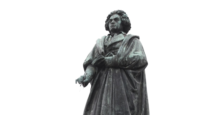 monument to beethoven in the city of Cologne. birds fly in the background. autumn. Germany. Cologne
