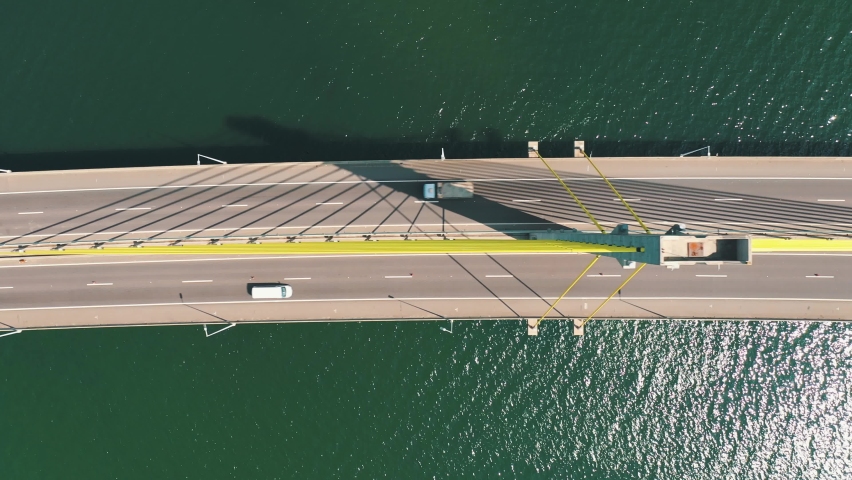 Bridge above the ocean aerial top down view of the traffic, located in Laguna, Santa Catarina, Brazil