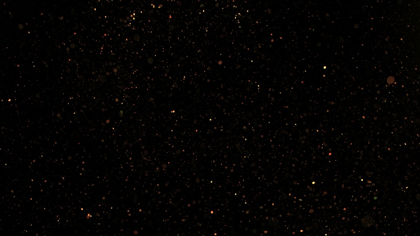 Super Slow Motion Shot of Golden Glitter Background Isolated on Black at 1000 fps. | Shutterstock HD Video #1067526674