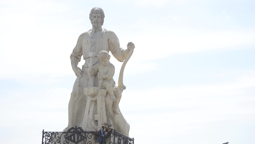 Marble statue of Saint Joseph and the child Jesus. White marble statue in the city of Valencia
