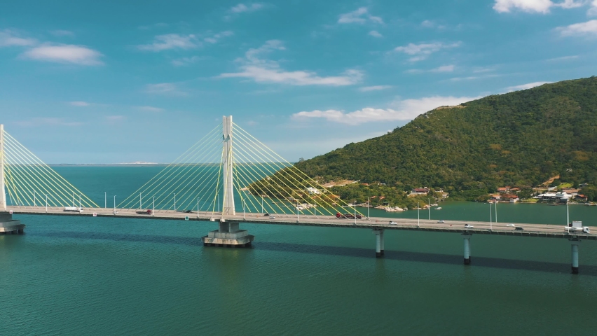Bridge above the ocean on tropical country aerial view, located in Laguna, Santa Catarina, Brazil