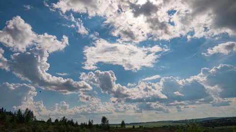 White clouds, clear soft sky, time lapse formating cloudscape in horizon, rainy rolling fast moving, beautiful summer sunny day, colourful weather.