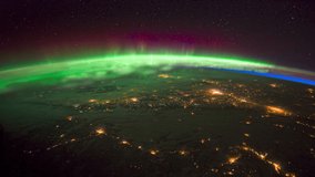 ISS Time-lapse Video of Earth seen from the International Space Station with dark sky and Aurora Borealis at night over Canada, Time Lapse Full HD. Images courtesy of NASA. Pan down motion timelapse. 