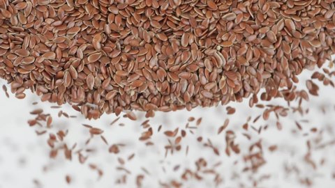 Close slow motion footage of flax seeds dropping 스톡 비디오