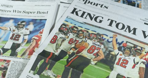New York, New York  United States - February 7,  2021: Newspaper Coverage of Tom Brady winning Super Bowl 55 as a member of the Tampa Bay Buccaneers. Headline: KING TOM VII