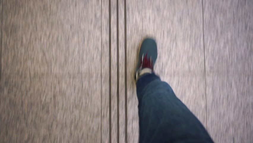 Border-free environment in urban solutions. Inclusion.Pedestrian makes steps along tactile designation special lane on sidewalk. Designation place public transport doors at bus stop sign for disabled 