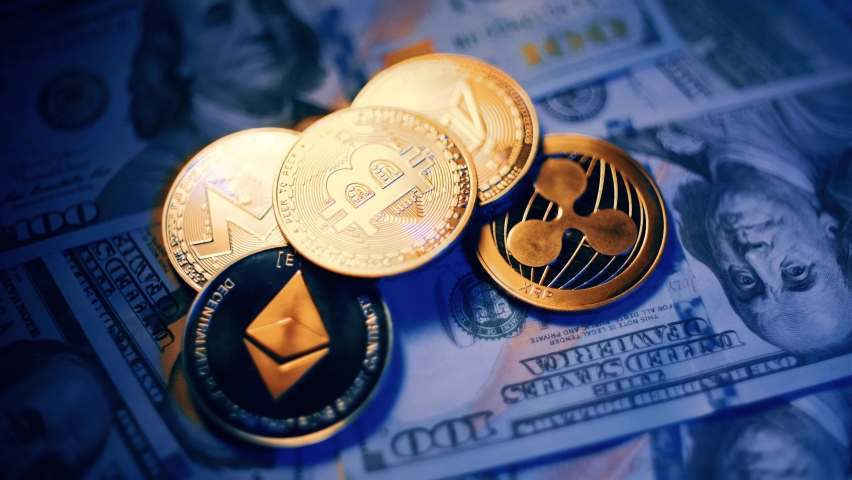 Bitcoin BTC coin and Ethereum ETH coins are rotating on bills of 100 dollars. Digital coin cyberspace and cryptocurrency. Concept of exchange market and online payment. | Shutterstock HD Video #1067596460