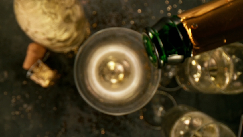Super slow motion of pouring champagne into glass with camera motion. Filmed on high speed cinema camera. | Shutterstock HD Video #1067606210