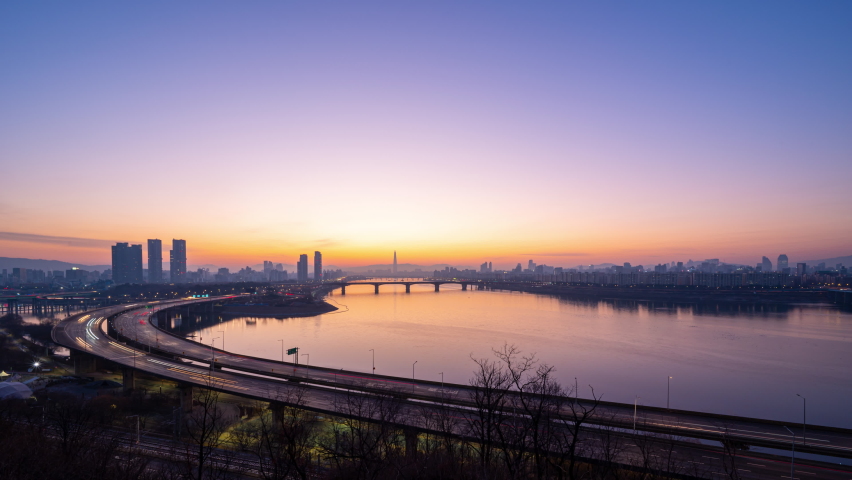 Time lapse Landscape of Seoul city South Korea. And sunrises.And traffic on the highway along the river Han Royalty-Free Stock Footage #1067608310