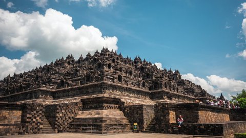 Magelang, Indonesia - August 25: Timelapse view of tourists visiting the ancient ruins of Borobudur, a 9th-century Mahayana Buddhist temple in Magelang, near Yogyakarta, Central Java, Indonesia.