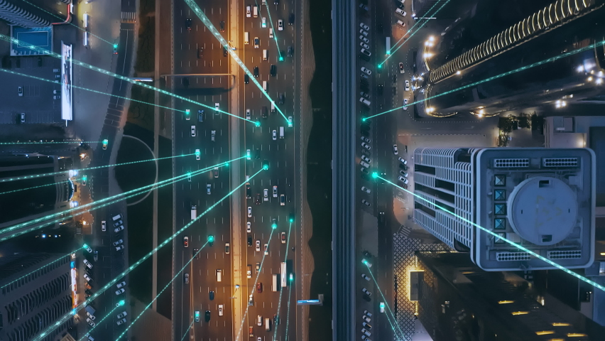 Aerial Drone Shot Autonomous Self Driving Cars Moving Through City Surveillance System Artificial Intelligence Scans Cars GPS Tracking Movement 5G Connection Satellite IoT Network