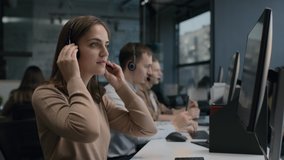 Call center and helpful customer service. Use desktop pc at computer table and phone line at modern co-working. Diverse group of workers talks on sale hotline 24-7. Busy seller at agency office indoor - Powered by Shutterstock - Get 15% off with code: PIKWIZARD15