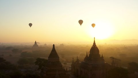 Aerial view of temple silhouette. Amazing aerial view over and close to Bagan temples at sunrise.: film stockowy