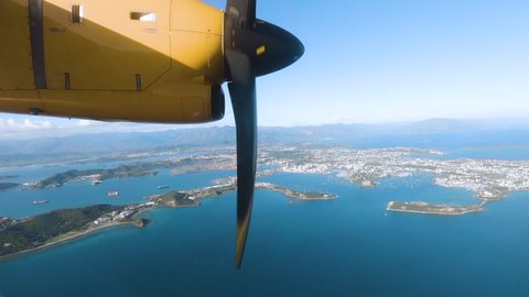 Aerial Footage from a plane window of Noumea city and waterfront. New Caledonia.