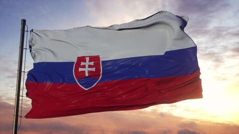 Flag of Slovakia waving in the wind against deep beautiful sky at sunset