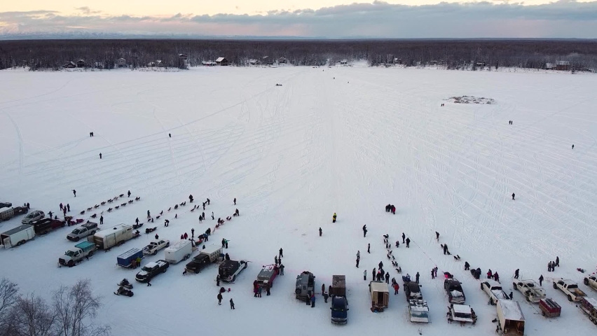 Alaskan Sled Dog Race, Mushers Start of Willow 300 - Aerial Drone Push Flyover