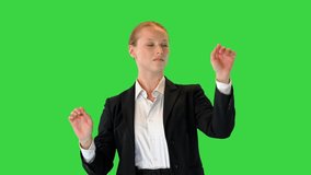 Blond woman interacting with a virtual reality screen on a Green Screen, Chroma Key. - Powered by Shutterstock - Get 15% off with code: PIKWIZARD15