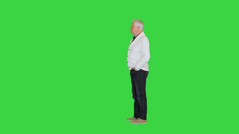 Senior mature man thinking or trying hard to remember something on a Green Screen, Chroma Key.