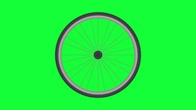 Bicycle wheel spinning on green background